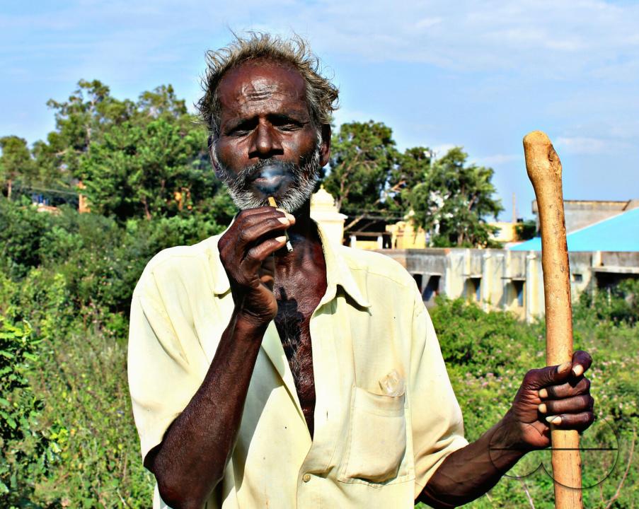 Portrait of a farmer during a hard day's work at a rural village