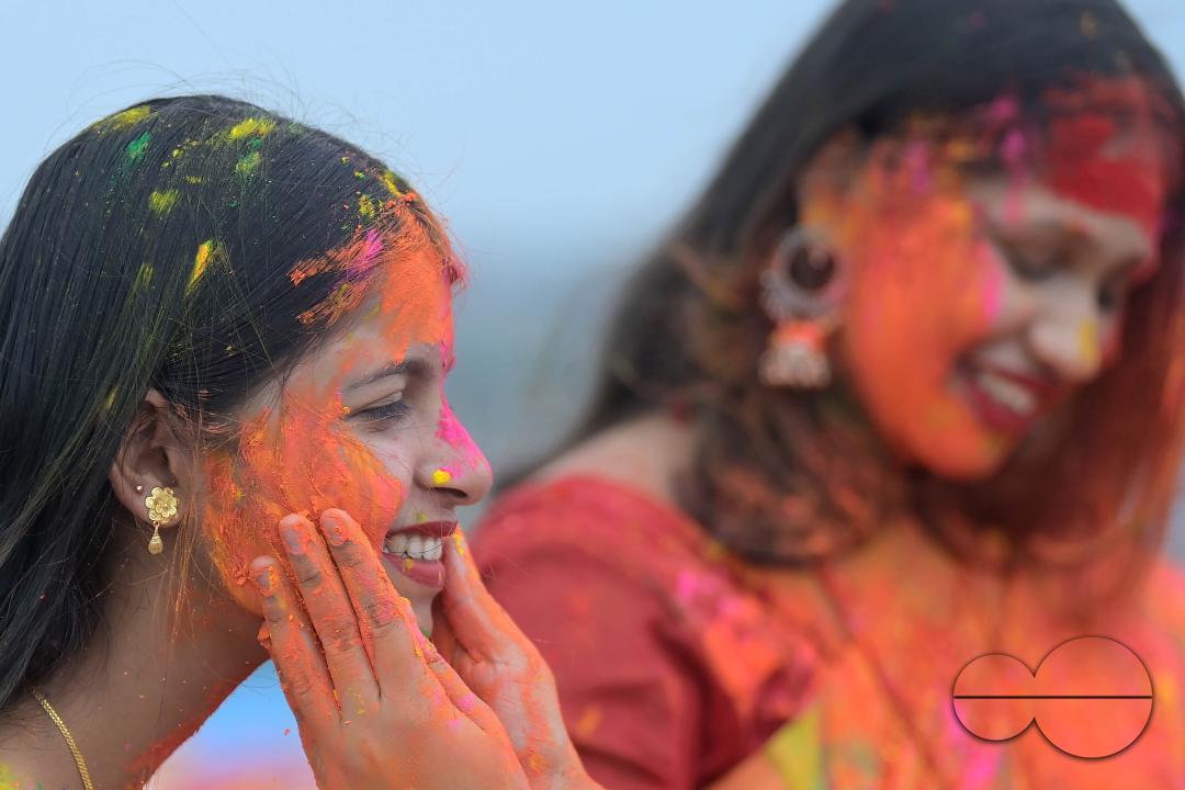 Indian girls adorned with 'Gulal' or coloured powder during the Hindu spring festival 'Holi', the festival of colour in Agartala