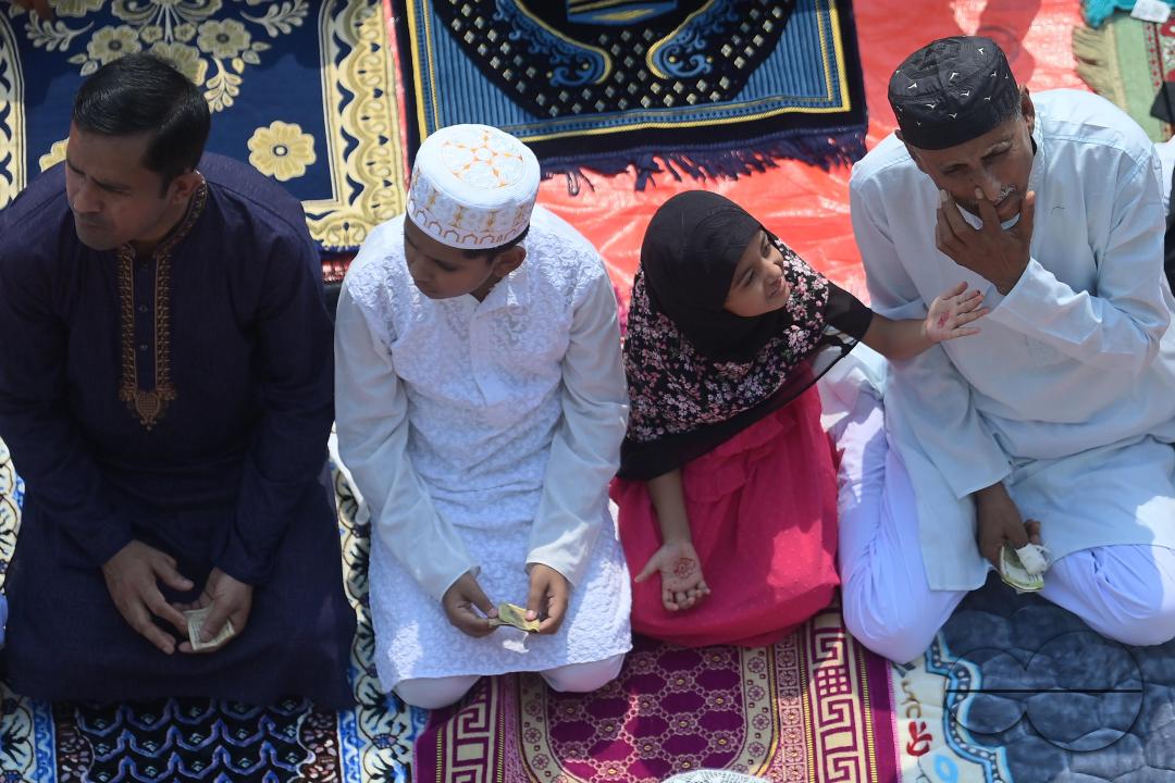 Devotees celebrate Eid-ul-Fitr with prayers ("Namaz") at a mosque in Agartala
