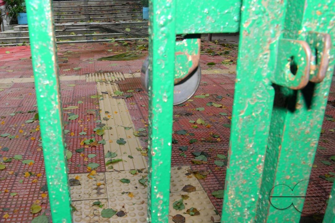 A locked gate of a government school during cyclone MidhiliÂ in Agartala