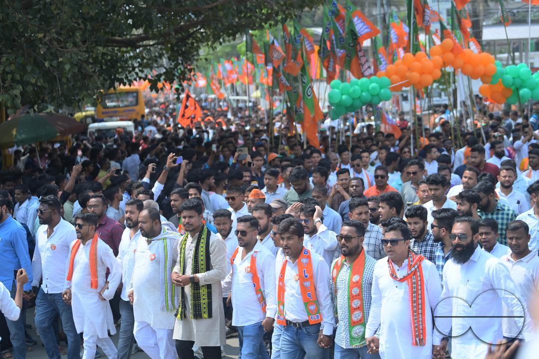 BJP supporters seen in a rally with Tripura Chief Minister Manik Saha, former CM and BJP candidate Biplab Kumar Deb, and Kriti Singh along with other leaders during an election campaign rally in support of Lok Sabha candidates at Agartala