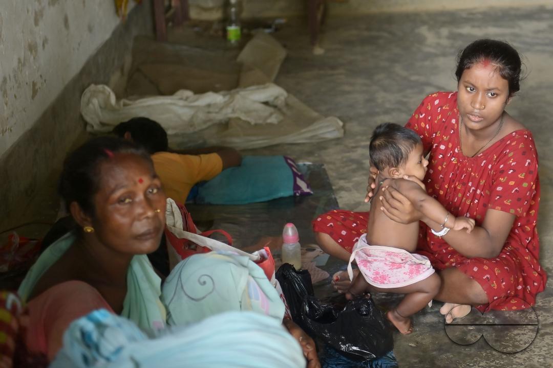 A mother with her son at a temporary relief camp at Pratapgarh English Medium School in Agartala