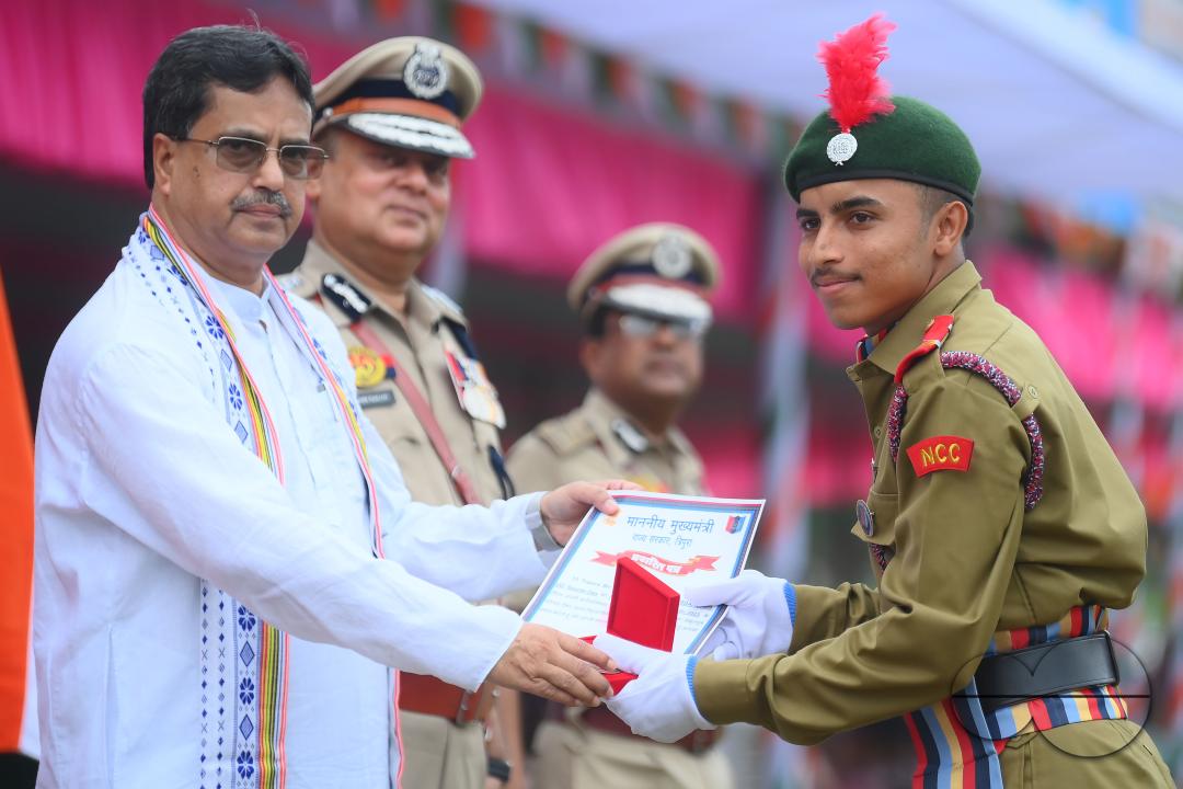 Tripura Chief Minister Manik Saha distributes awards and medals to the soldiers of different platoons during the 77th Independence Day function at the Assam Rifles ground in Agartala