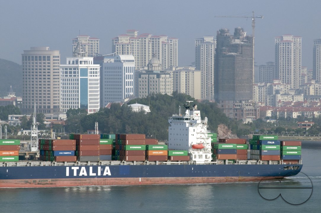 CHINA European ships half-loaded with containers, due to recession, leaving Xiamen harbour, Fujian province.