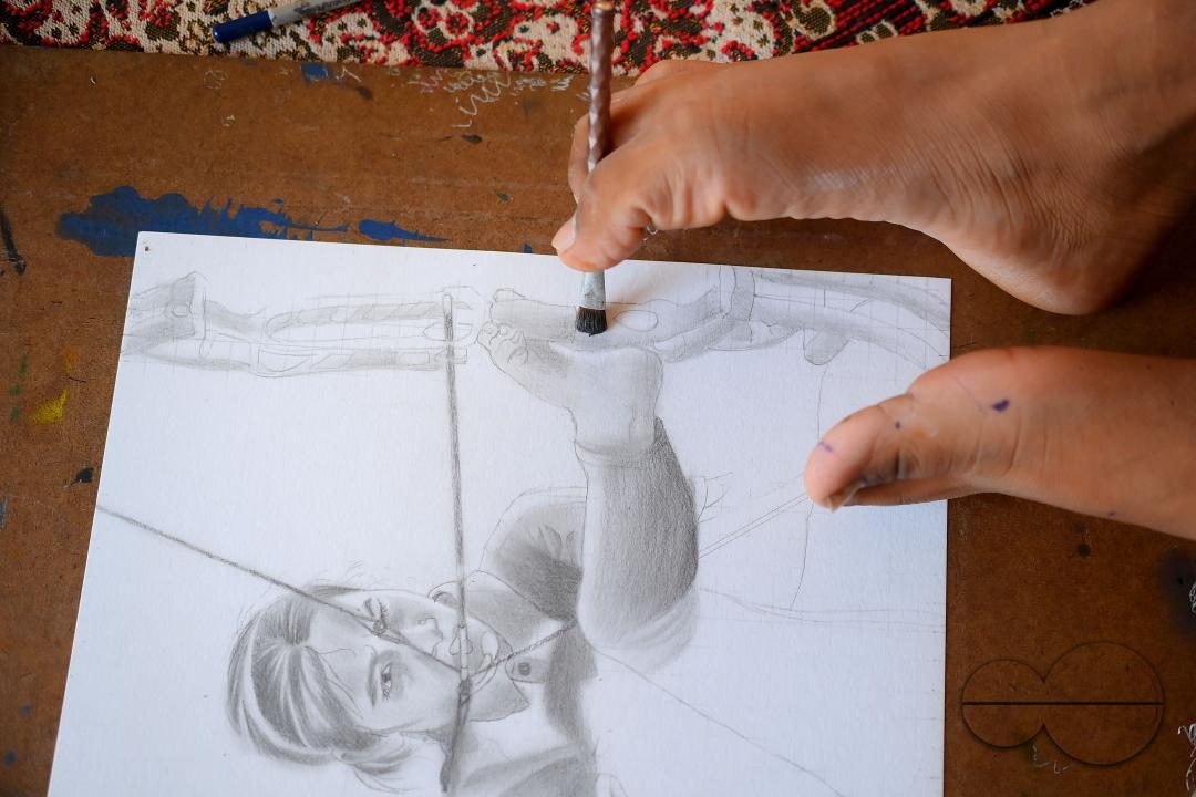 A 23-year-old differently abled artist Pralay Dey, is pursuing his bachelorâs degree in psychology from Tripura Central University