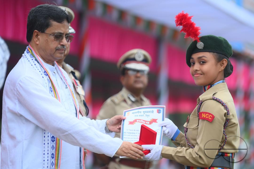 Tripura Chief Minister Manik Saha distributes awards and medals to the soldiers of different platoons during the 77th Independence Day function at the Assam Rifles ground in Agartala