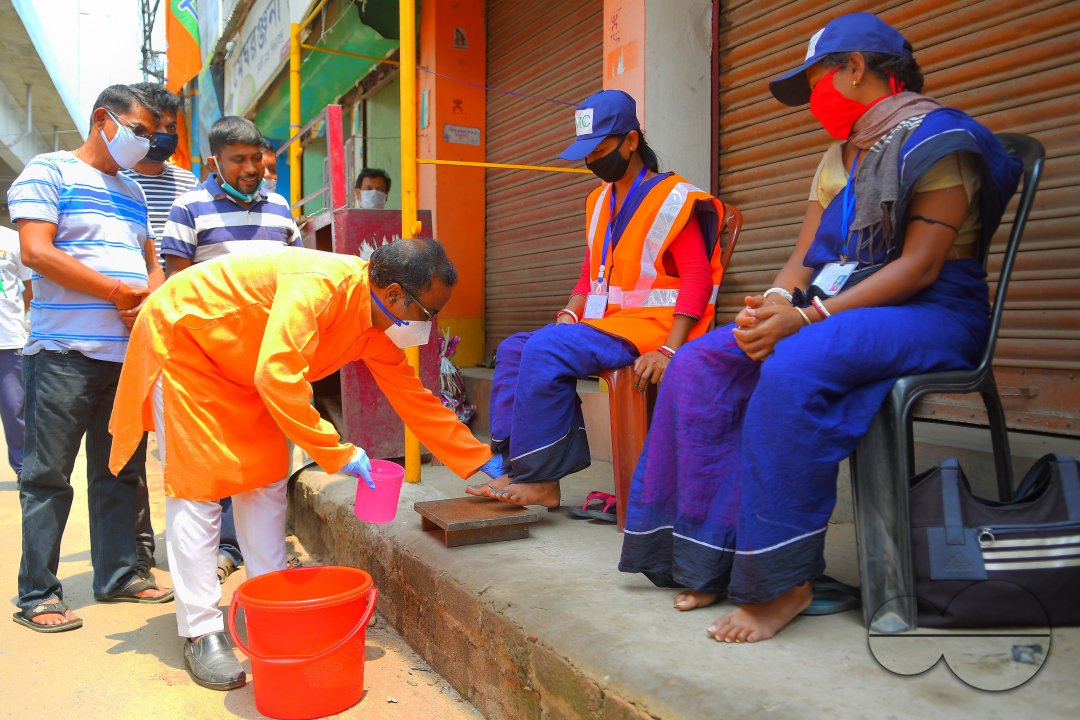 Cleaning the feet of safari workers (Cleaning Staff)