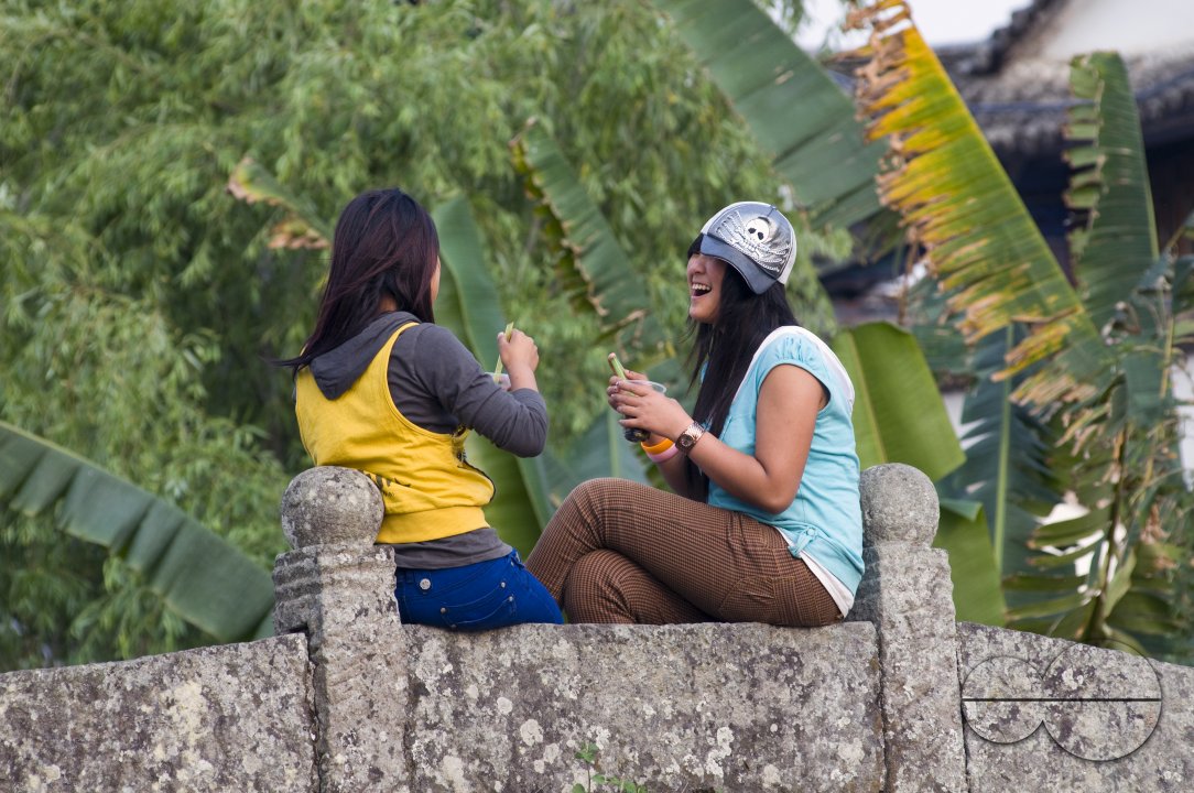 CHINA Teenage girls with soft drinks at a village in Yunnan province..