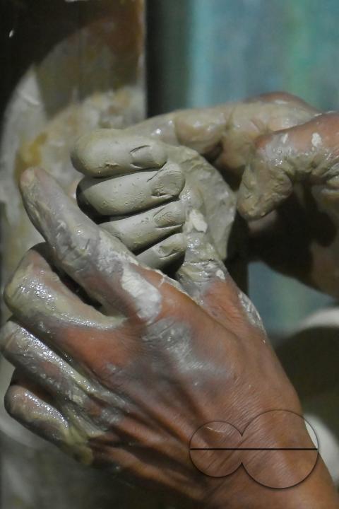 An Idol maker making idols of Lord Ganesh in a studio for the upcoming Ganesh Chaturthi festival at Agartala