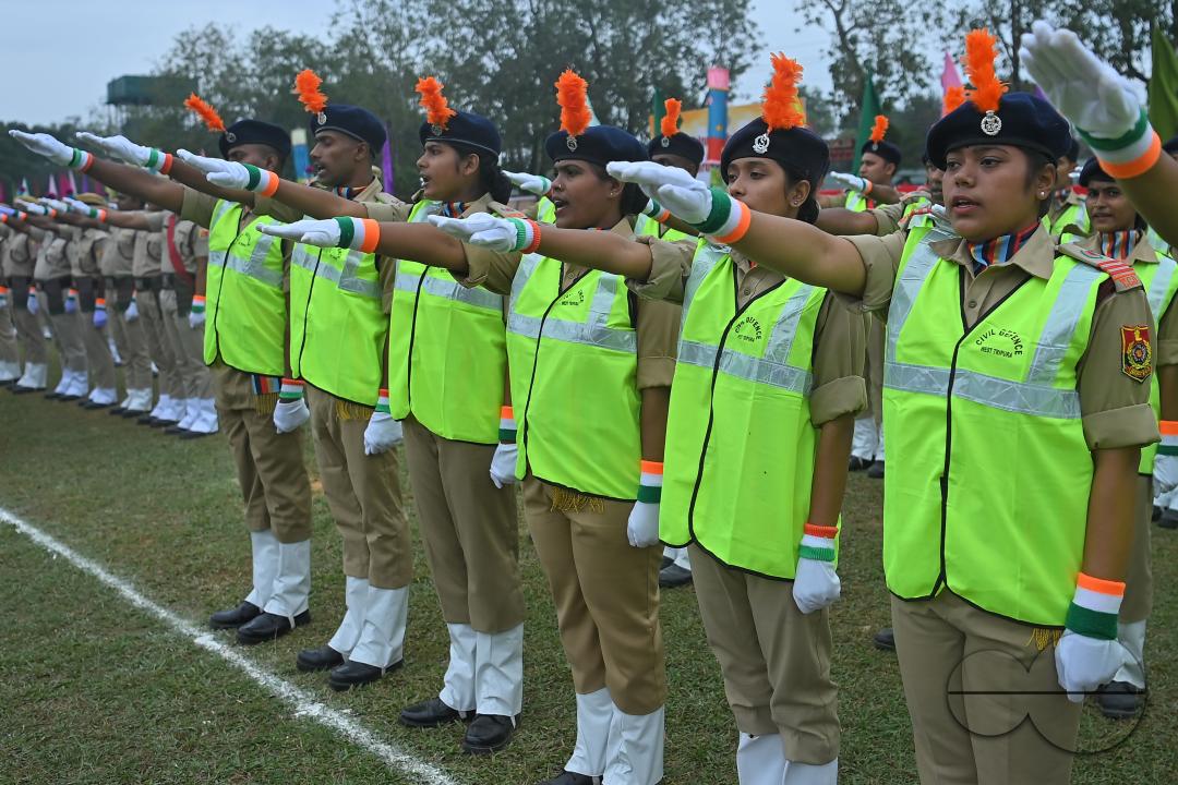 Troopers from the NDRF, Home Guards and Civil Defence take oath on the 61st All India Civil Defence and Home guards raising day at the police parade ground in Agartala