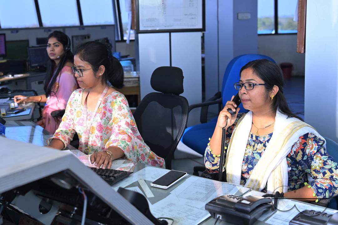 Female traffic controllers, Bipasha Hrangkhawl, Disha Chandra, and Chaya, take charge of traffic management at the Agartala airport's ATCT Tower to celebrate International Women's Day