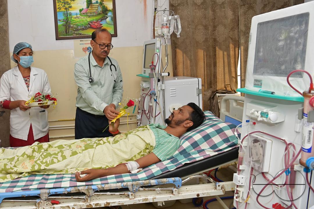 Doctors, along with health workers, distribute roses and fruits during the celebration of World Kindness Day in the dialysis ward at IGM (Indira Gandhi Memorial) Hospital in Agartala