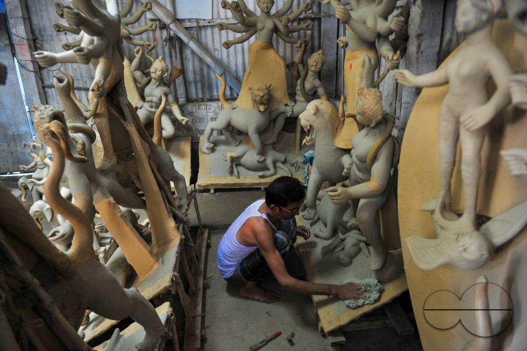 Nondi Pal, an idol artist is working on structures of Hindu Deity in preparation for the upcoming Durga Puja Festival 2023