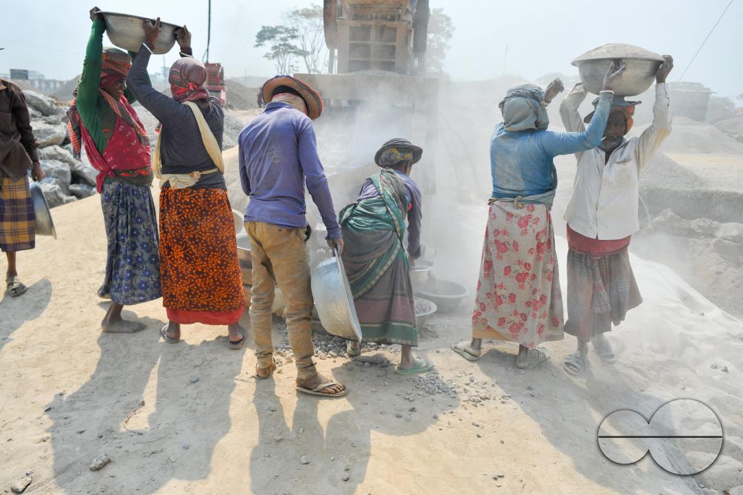 Male and female workers are breaking LC stones with a crusher machine in Bholaganj area, known as the 'Stone State' of Sylhet Companyganj Upazila
