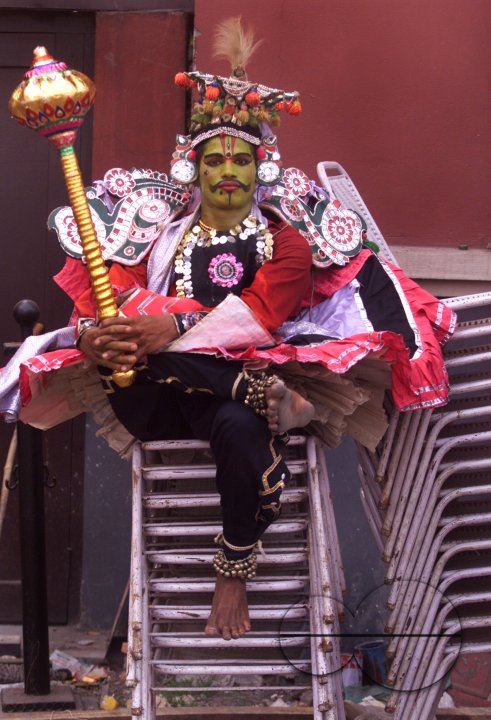 A South Indian dancer waits for his turn during a stage show at a dance festival in Kolkata, India