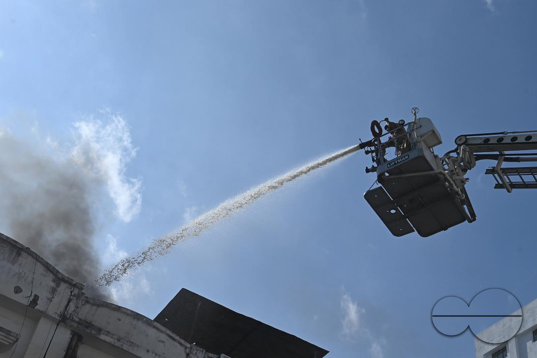 Fire brigade personnel are trying to control a fire on the top of the building of the dental college during a state level mock exercise on earthquake day at Agartala