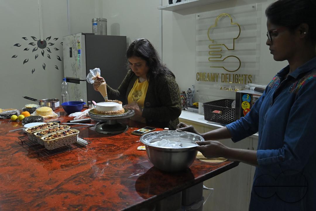 Sutapa Choudhary, a cake artist and teacher, making cakes at her cake parlour, "CREAMY DELIGHTS"