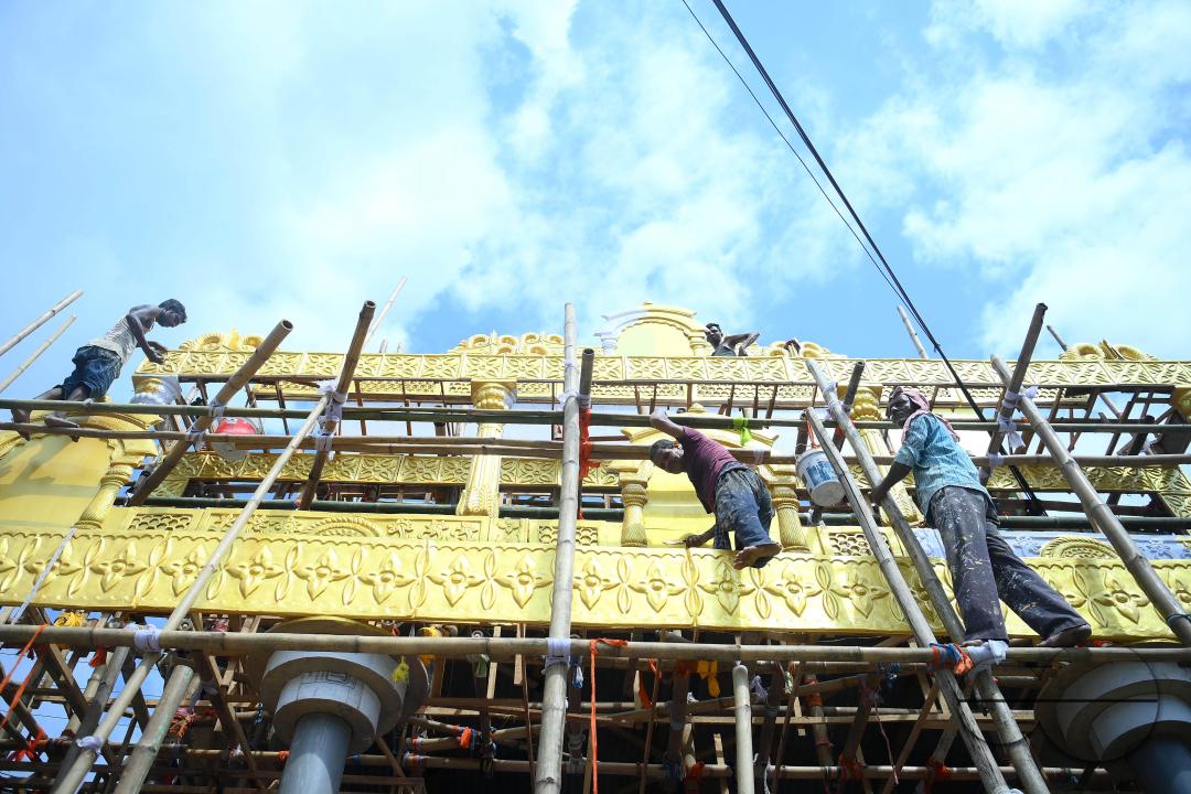 Workers are making a pandal, a temporary structure set up to usually venerate the God and Goddess, ahead of Ganesh Chaturthi festival in Agartala