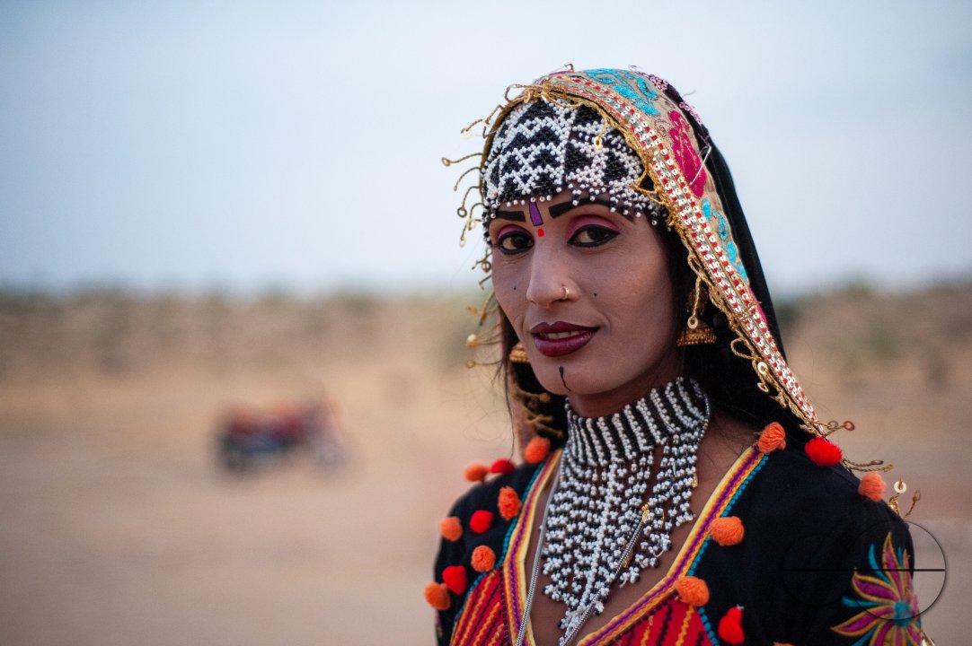 A dancer who performs for tourists in the desert in traditional Rajasthani attire.
