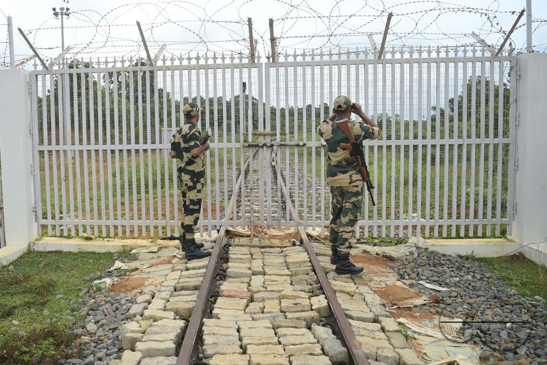Security personals of the Border Security Force (BSF) providing tight security and patrolling the India- Bangladesh rail line in Nischinta Pur area, in precaution to the ongoing anti-quota protests in neighbouring country Bangladesh