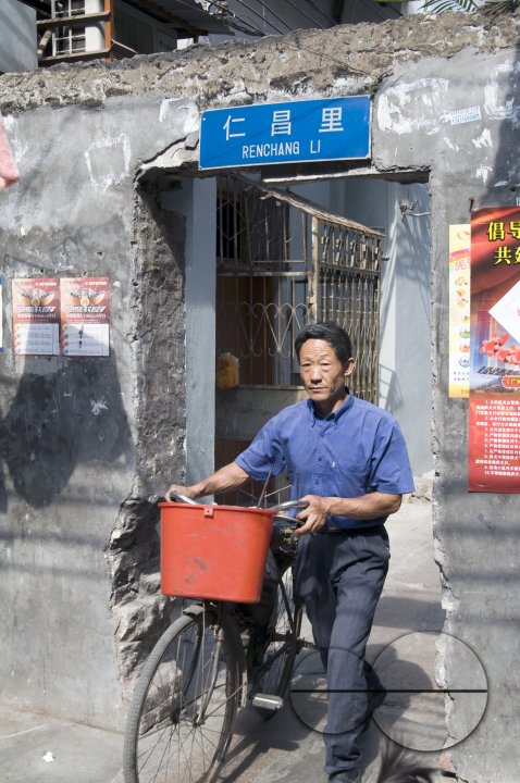 CHINA Elderly man with bycicle in the old quarter in Guangzhou, Guangdong province..