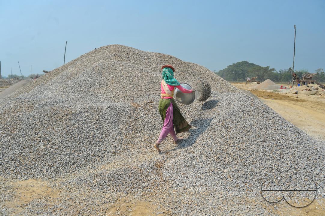 Male and female workers are breaking LC stones with a crusher machine in Bholaganj area, known as the 'Stone State' of Sylhet Companyganj Upazila