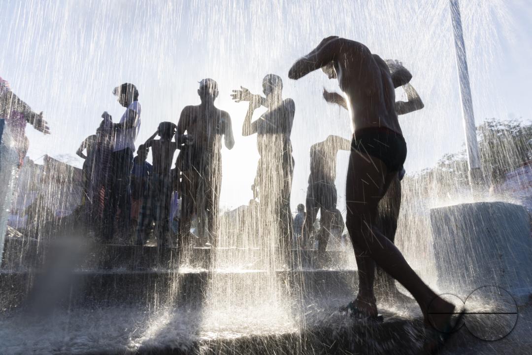 People bathing near the Durga Mata temple of Edupayala in Medak district of Telangana state during Durga Mata festival