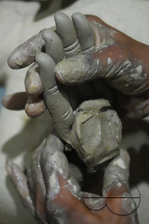 An Idol maker making idols of Lord Ganesh in a studio for the upcoming Ganesh Chaturthi festival at Agartala