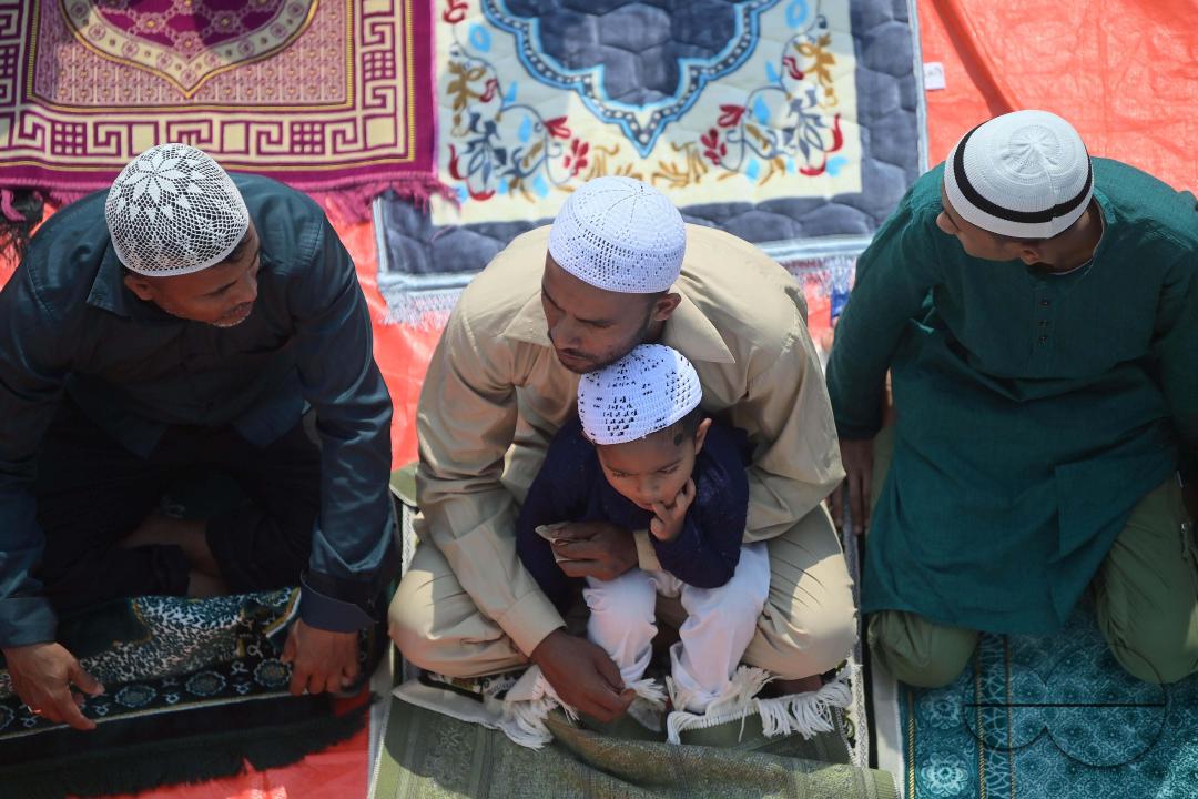 Devotees celebrate Eid-ul-Fitr with prayers ("Namaz") at a mosque in Agartala