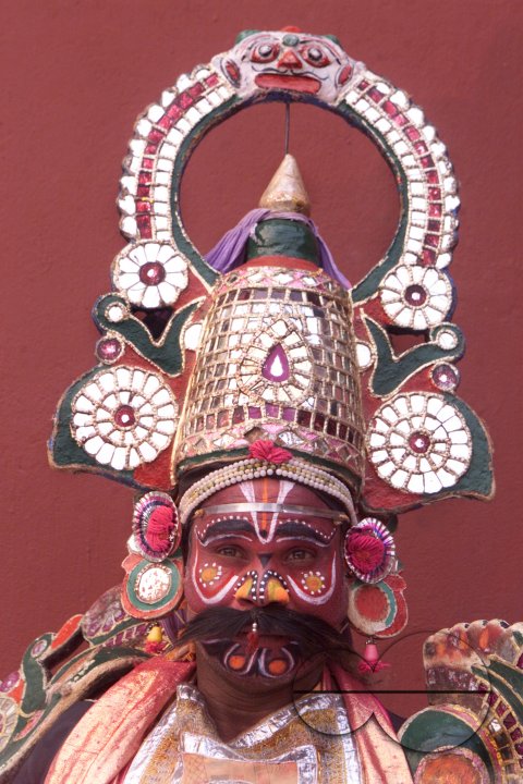 A South Indian dancer stands before a stage show at a dance festival in Kolkata