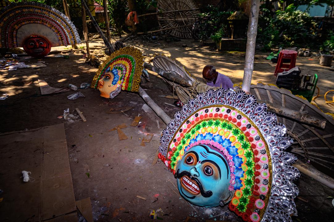 A village idol artist makes large color masks modeled after Purulia Chhau dance masks (Purulia Chhau dance is listed on UNESCO's World Heritage list of dances) of goddesses, animals, and rakshasas (humanoid demons or unrighteous spirits) like Hindu mytho