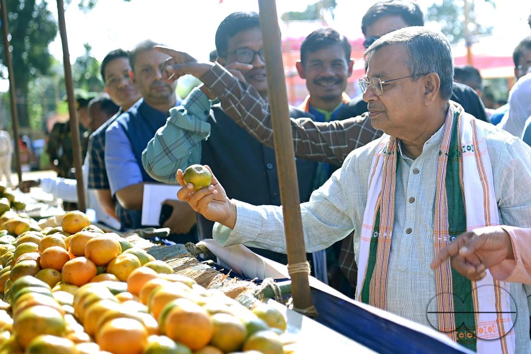 Minister for Agriculture and Farmers Welfare, Ratan Lal Nath inspects oranges during the Orange Festival in Taibaglai Village (Killa) organized by the Agriculture and Farmers Welfare of Tripura