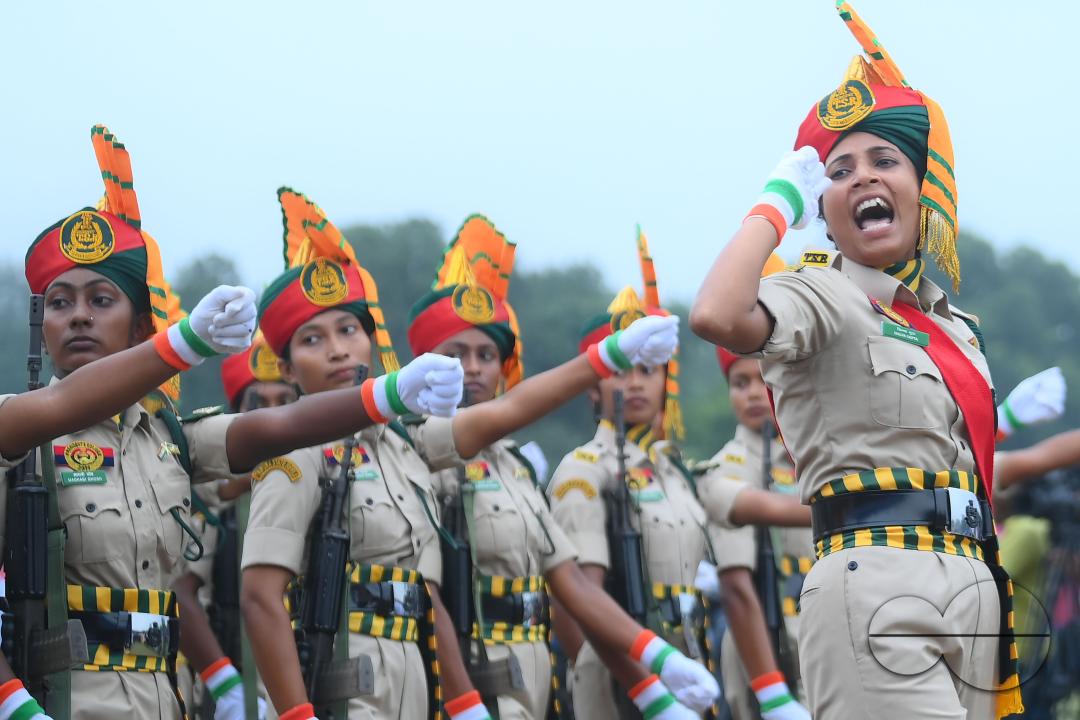 Soldiers of different platoons at the 77th Independence Day parade at the Assam Rifles ground in Agartala