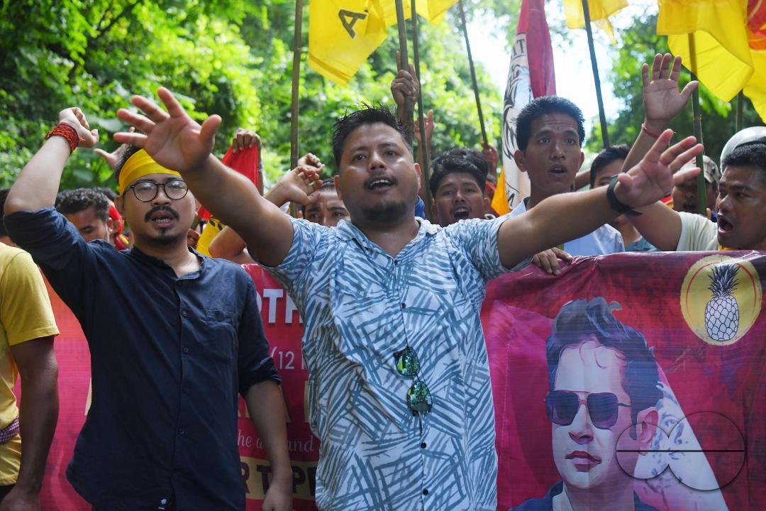 The âTipraha Indigenous Progressive Regional Alliance (TIPRA)ââ supporters raise slogans demanding a separate Greater Tipraland state for tribals, in Bermuda Ashram Para