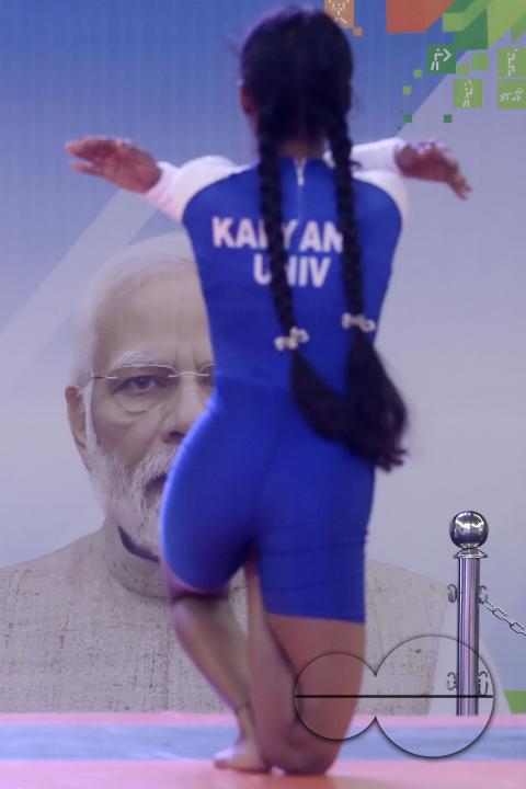 Students of Kalyani University in Orissa perform Yoga at the Khelo India University Games competition