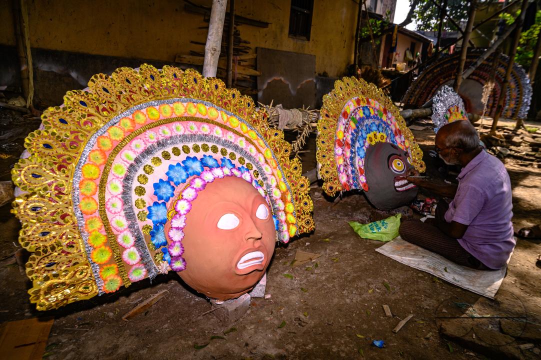 A village idol artist makes large color masks modeled after Purulia Chhau dance masks (Purulia Chhau dance is listed on UNESCO's World Heritage list of dances) of goddesses, animals, and rakshasas (humanoid demons or unrighteous spirits) like Hindu mytho