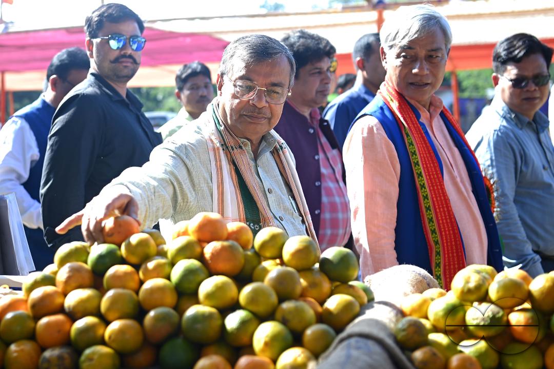 Minister for Agriculture and Farmers Welfare, Ratan Lal Nath inspects oranges during the Orange Festival in Taibaglai Village (Killa) organized by the Agriculture and Farmers Welfare of Tripura