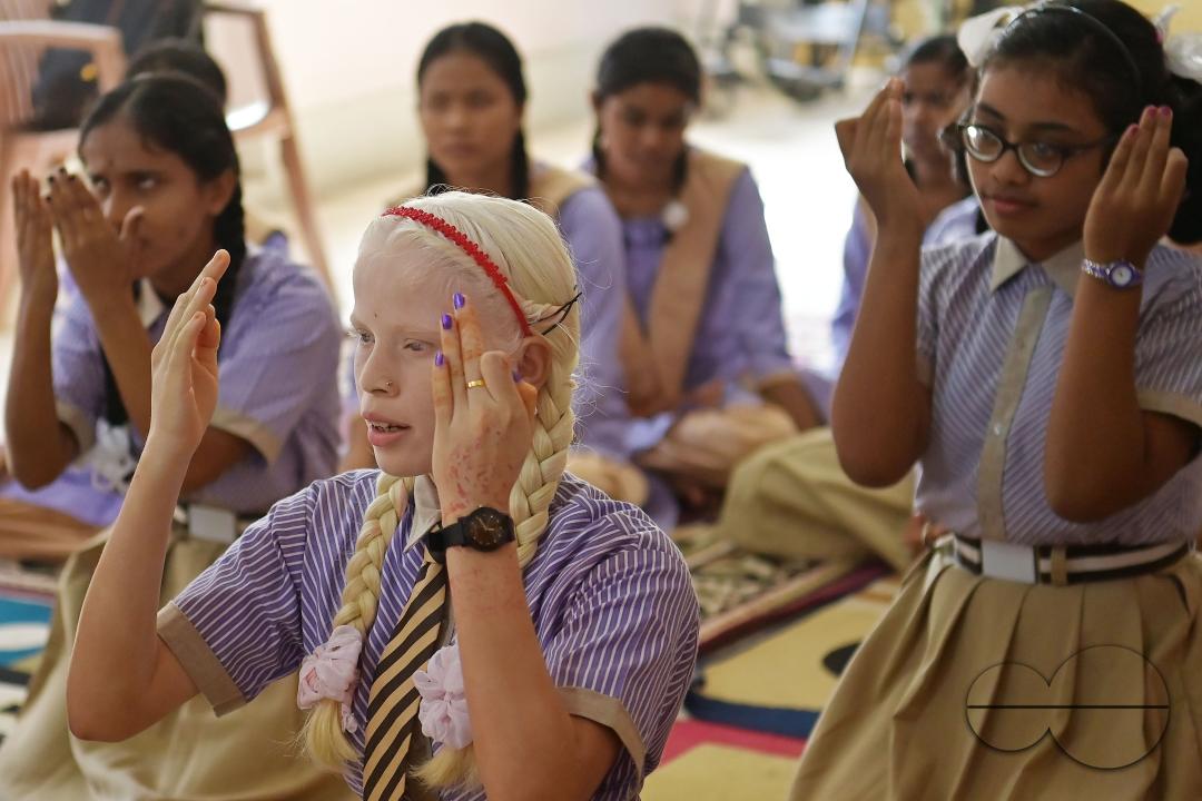 Students at the Institute for Visually Handicapped are performing a dance during the 'Children's Day' celebration at the institute's campus in Narsingarh, in Agartala
