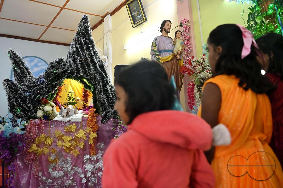 Christians attend a Christmas Mass in Mariam Nagar Church at Agartala