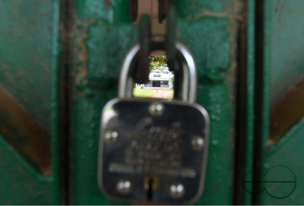 A locked gate of a government school during cyclone MidhiliÂ in Agartala