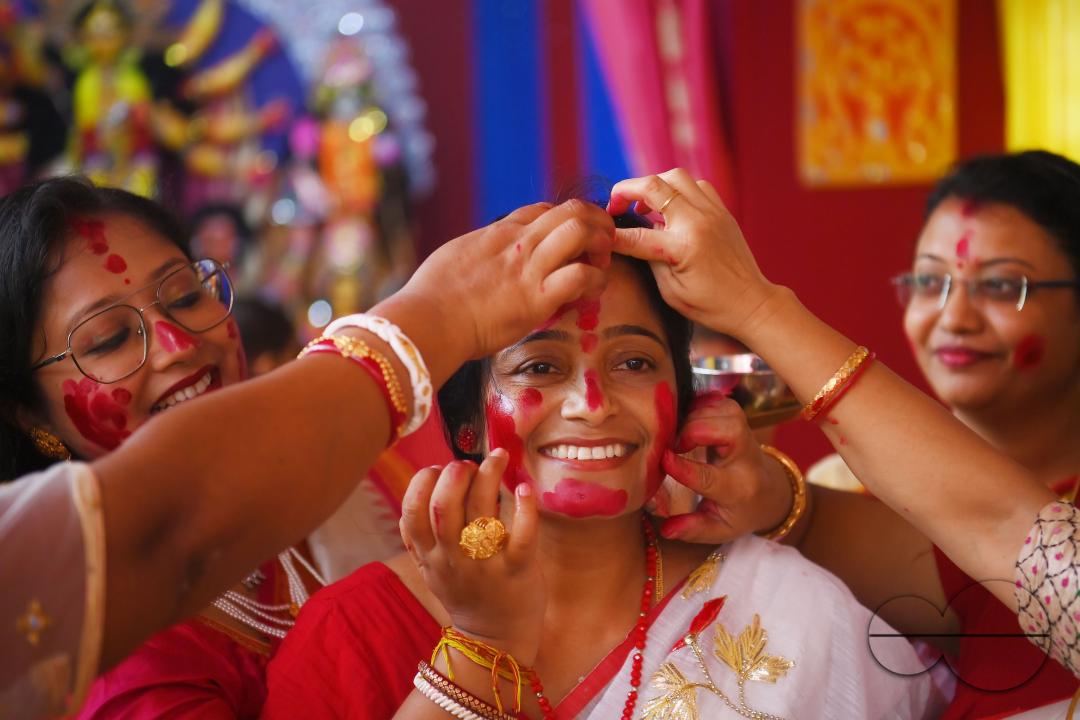 Married ladies smear red Sindoor or Vermillion, a ritual known as Sindur Khela or Vermillion Game on Vijayadashami, the last day of the Durga Puja festival