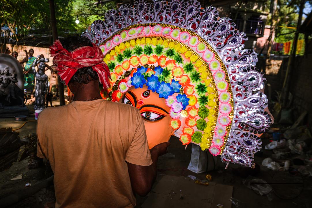 A village idol artist makes large color masks modeled after Purulia Chhau dance masks (Purulia Chhau dance is listed on UNESCO's World Heritage list of dances) of goddesses, animals, and rakshasas (humanoid demons or unrighteous spirits) like Hindu mytho