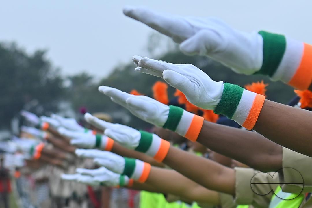 Troopers from the NDRF, Home Guards and Civil Defence take oath on the 61st All India Civil Defence and Home guards raising day at the police parade ground in Agartala