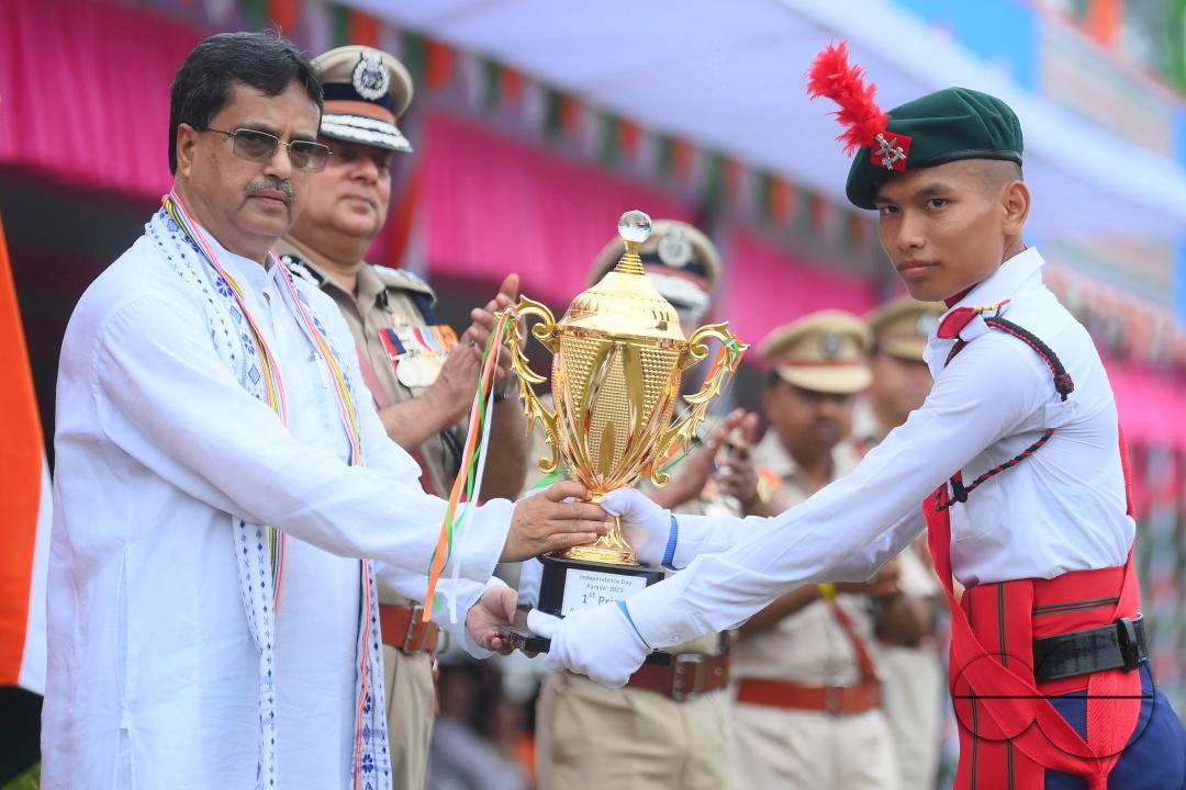 Tripura Chief Minister Manik Saha distributes awards and medals to the soldiers of different platoons during the 77th Independence Day function at the Assam Rifles ground in Agartala