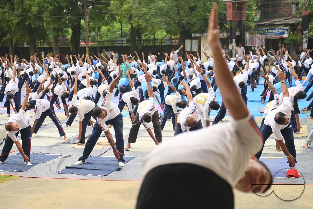 NCC cadets and officials perform yoga during 10th International Day of Yoga Day at BBM College Ground in Agartala