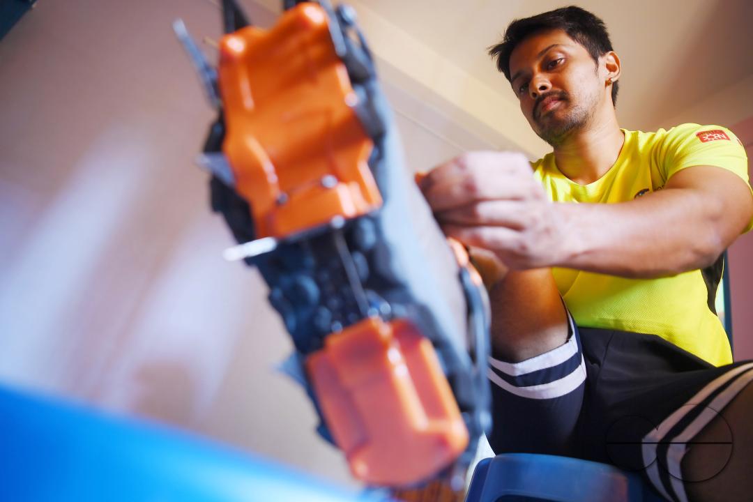 Aritra Roy, an IT professional and mountaineer, adjusting the spikes on his shoe after climbing the highest mountain in Europe, Mount Elbrus