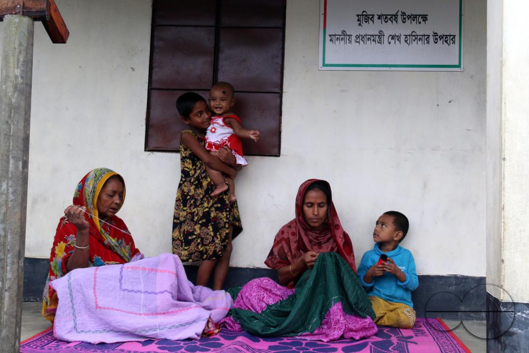 Rural Bangladeshi women sewing and embroidering bed sheets, pillow cases, rugs, table cloths and other household items which is their livelihood
