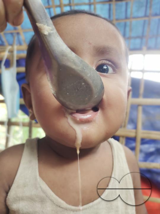A child been fed soup at the Balukhali refugee camp