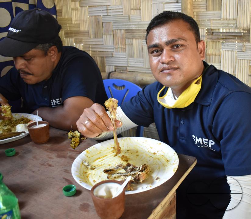 Portrait of  a man eating at the Balukhali refugee camp
