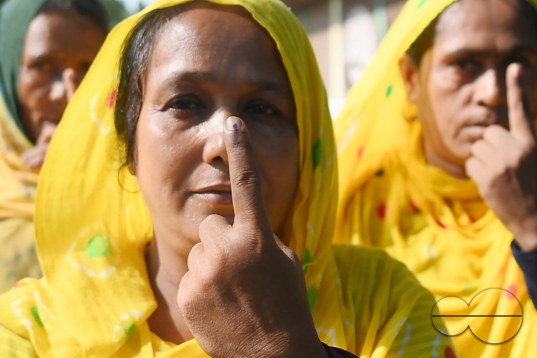 Elderly voters showing their finger marked with indelible after casting their vote during the by-elections for the Boxonagar assembly seat, in Tripura Sepahijala district